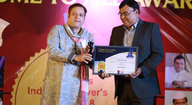 Manoj Joshi, a well-known Indian film and television actor, presented the award to Dr Bharat Agravat